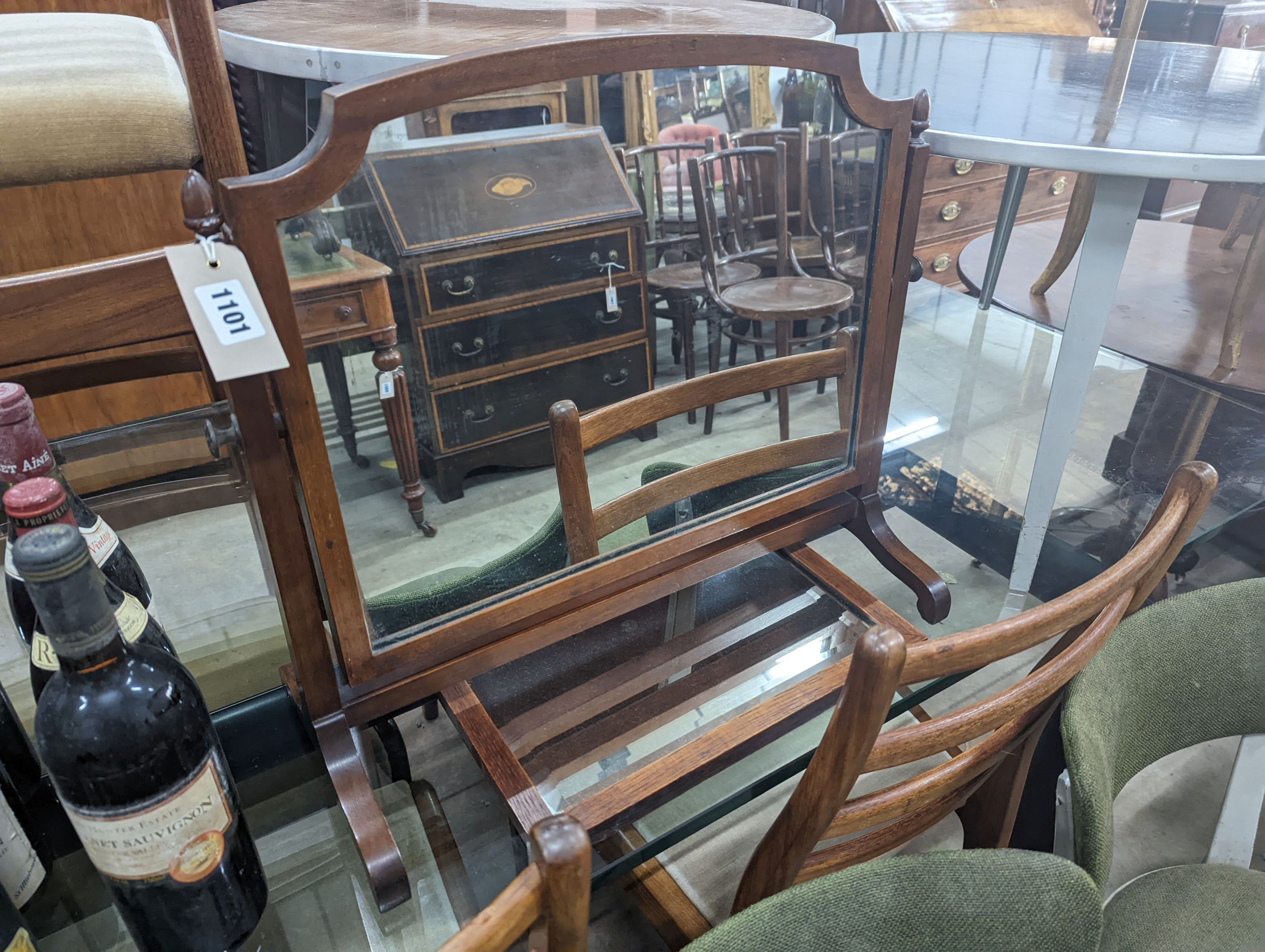 An Edwardian mahogany skeleton framed toilet mirror, width 54cm, depth 23cm, height 48cm together with a wall mirror